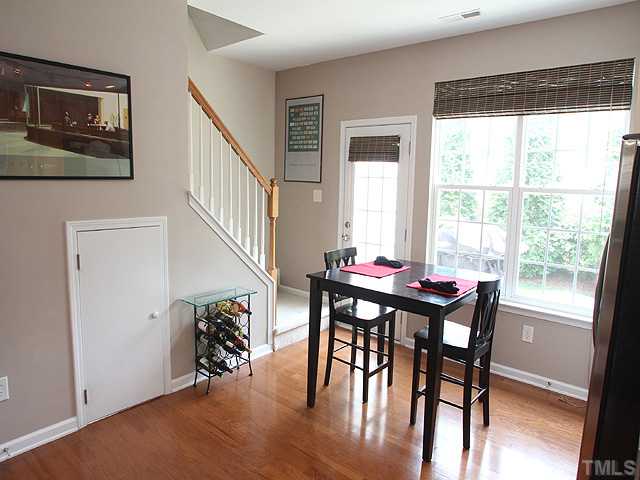 7813 Silverthread Lane Raleigh, NC 27617 - Photo 5 of 25 a view of a dining room with furniture window and wooden floor