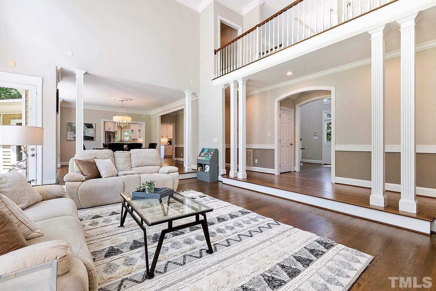100 Greyfriars Lane Cary, NC 27518 - Photo 14 of 71 a living room with furniture a rug and a table