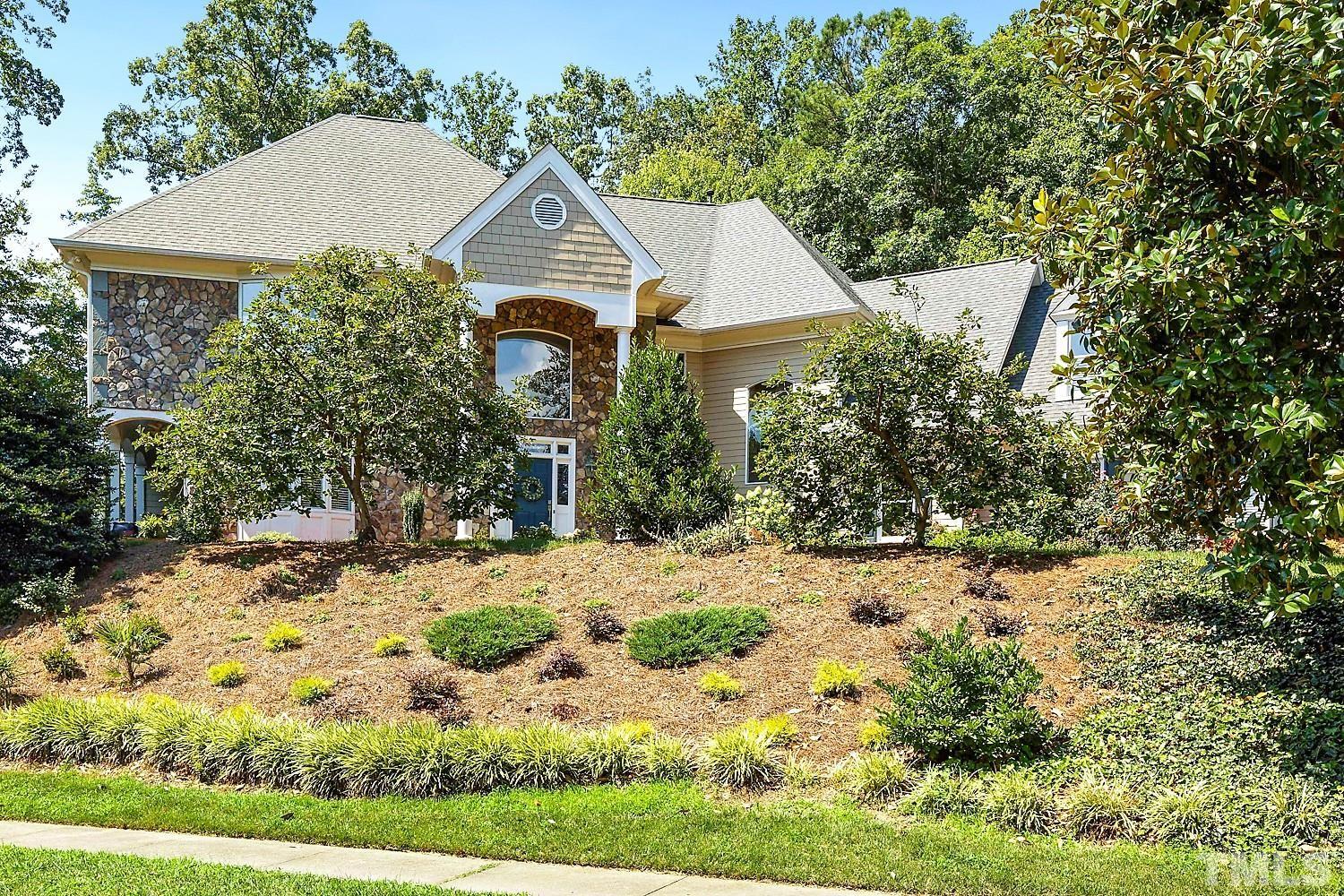 100 Greyfriars Lane Cary, NC 27518 - Photo 2 of 71 front view of a house with a yard