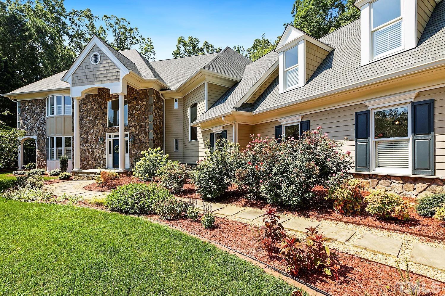 100 Greyfriars Lane Cary, NC 27518 - Photo 3 of 71 front view of a house with a yard
