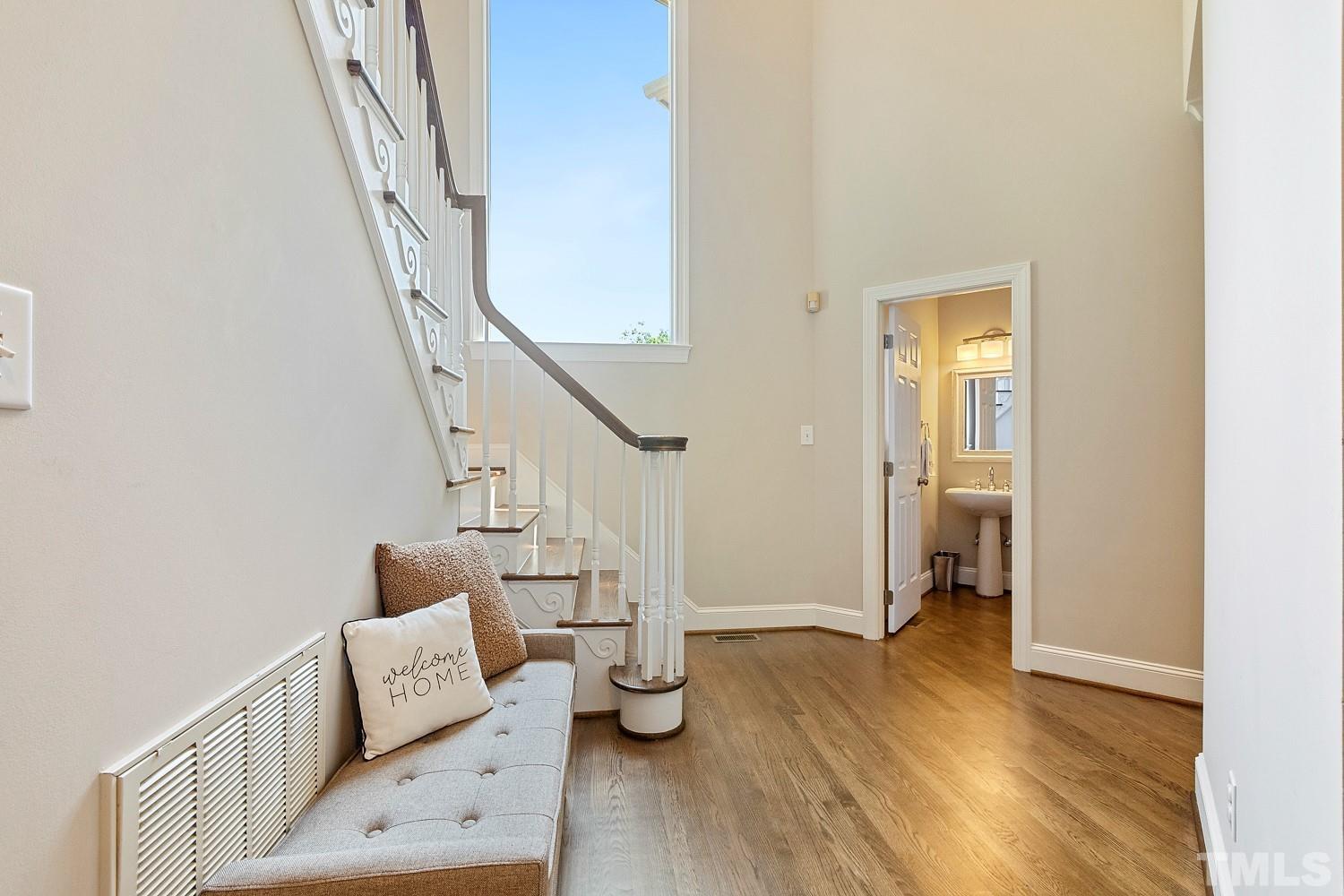 100 Greyfriars Lane Cary, NC 27518 - Photo 32 of 71 a view of entryway and hall with wooden floor