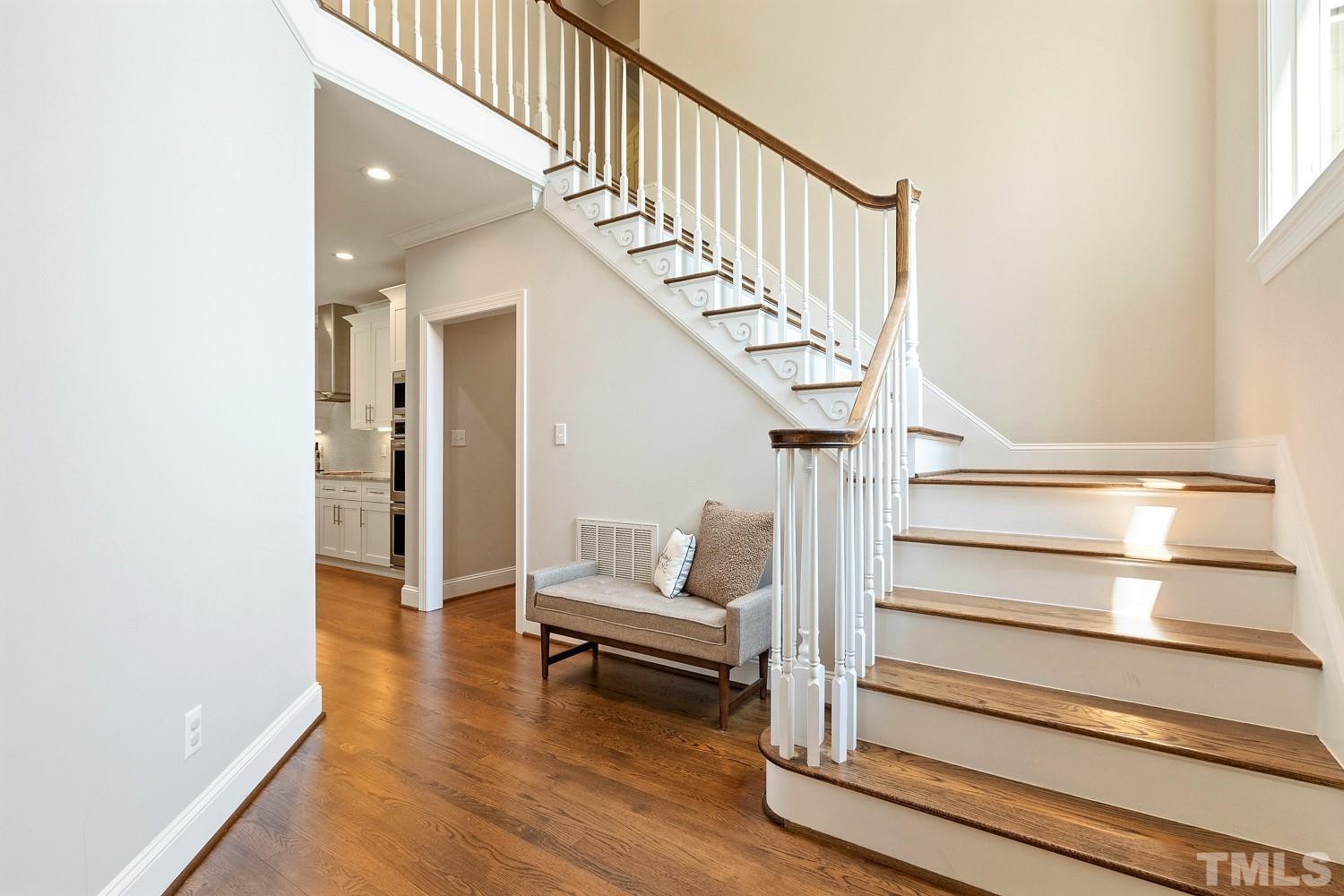 100 Greyfriars Lane Cary, NC 27518 - Photo 33 of 71 a view of entryway and hall with wooden floor
