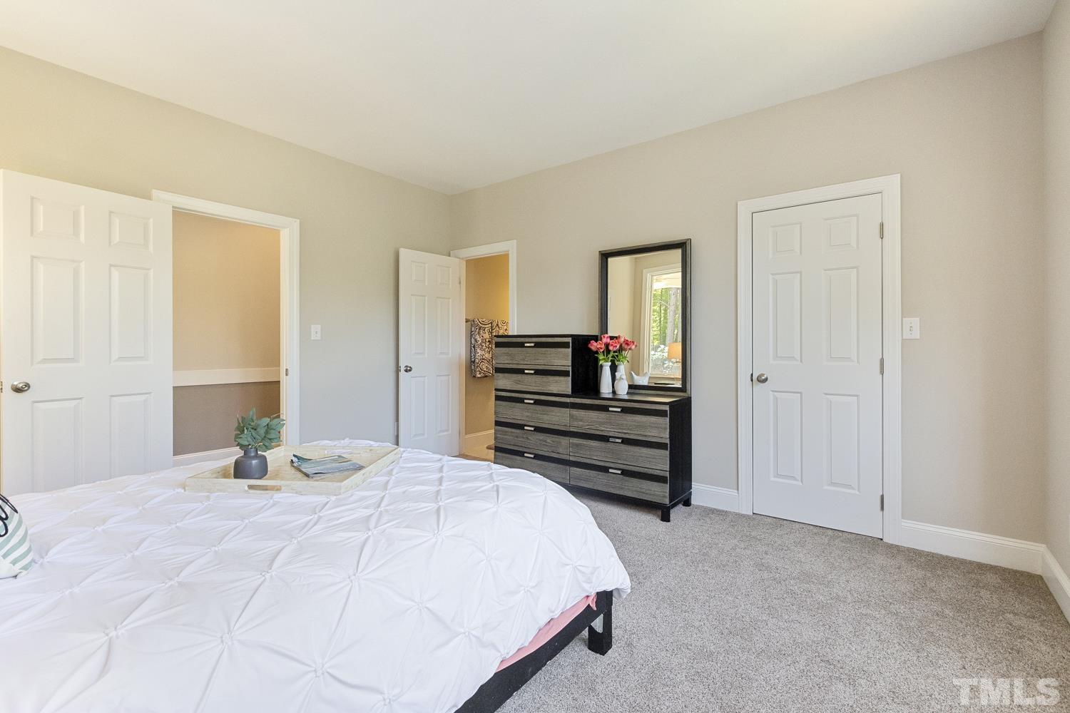 100 Greyfriars Lane Cary, NC 27518 - Photo 39 of 71 a bedroom with a bed and a closet