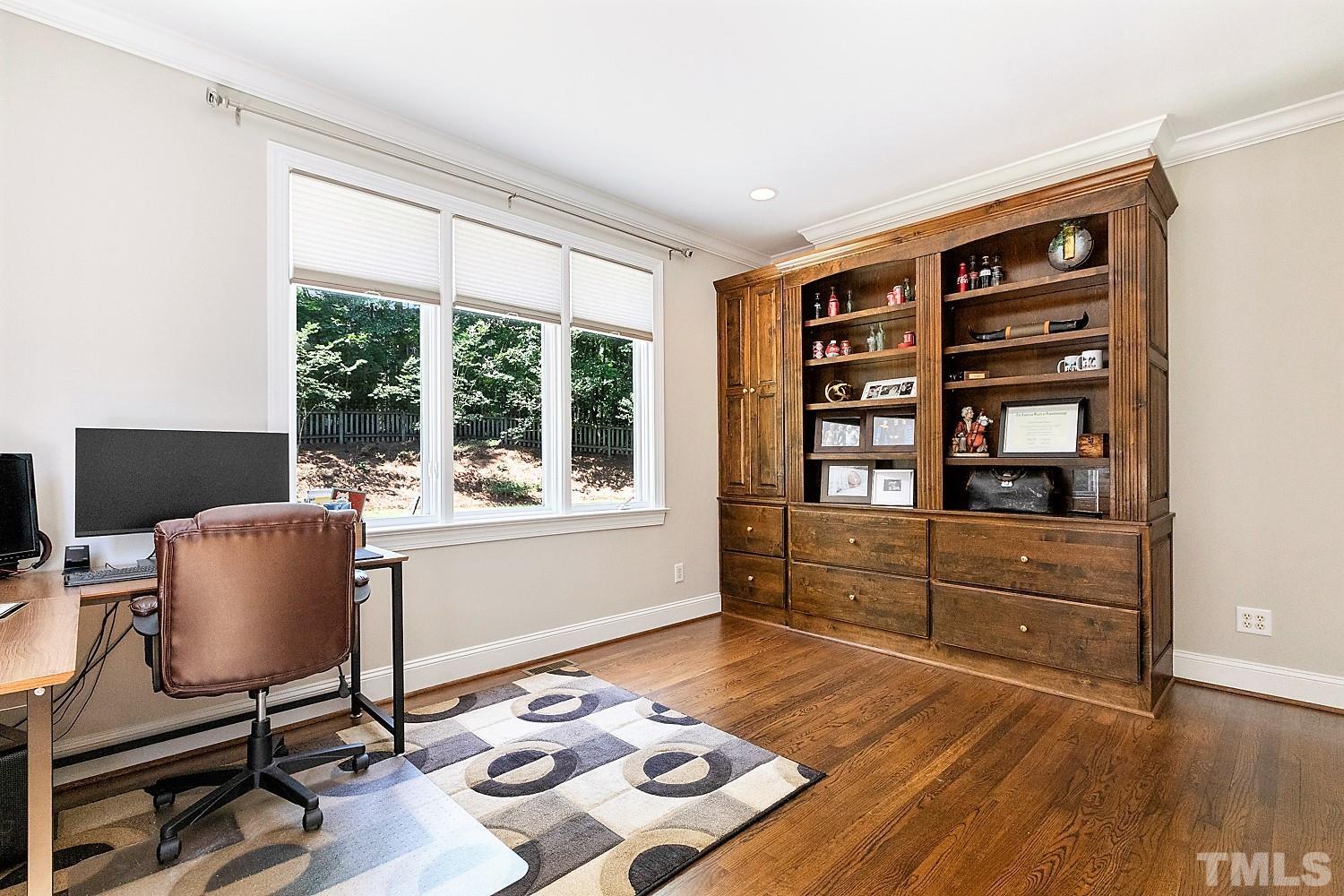 100 Greyfriars Lane Cary, NC 27518 - Photo 42 of 71 a room with a chair and large window
