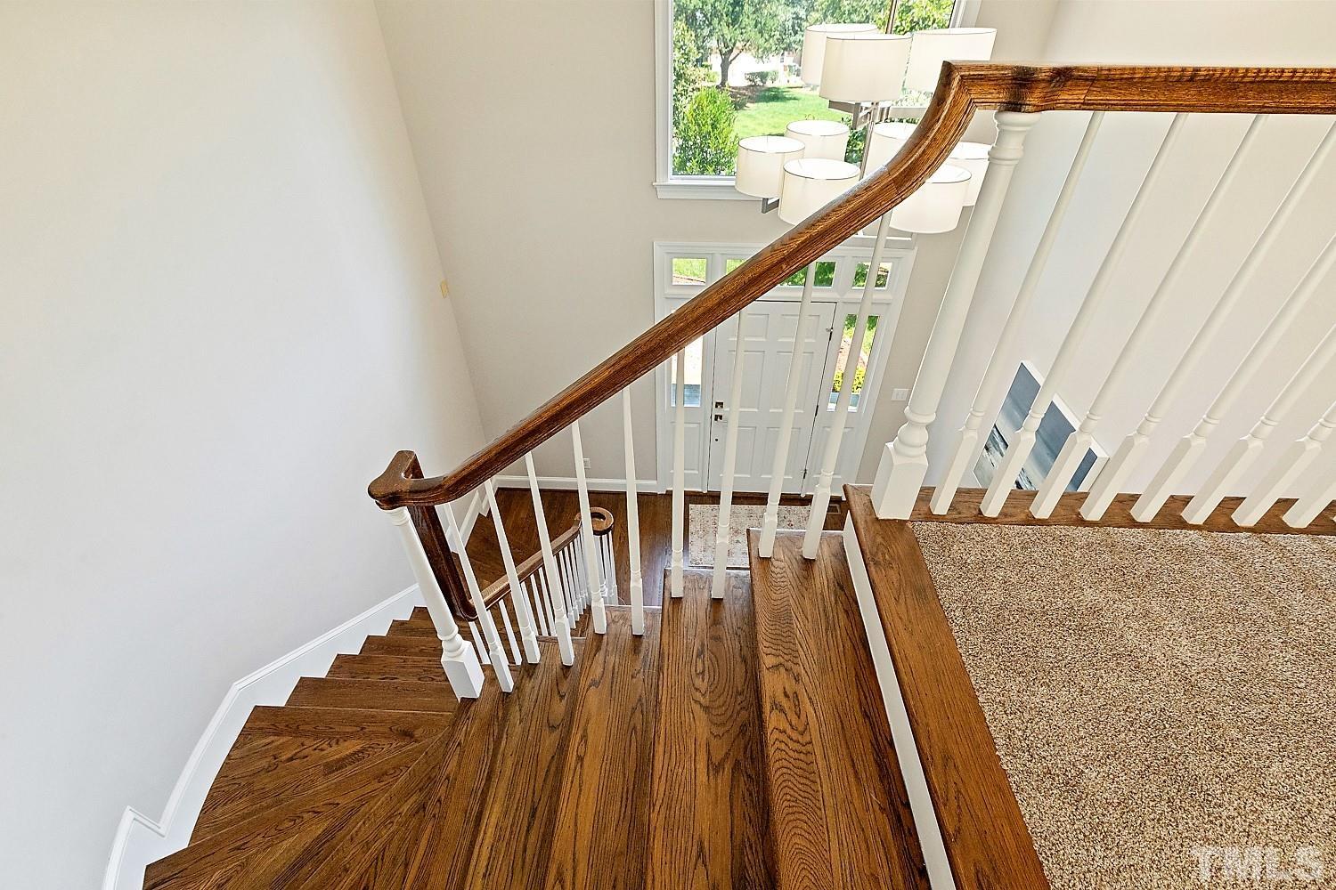 100 Greyfriars Lane Cary, NC 27518 - Photo 44 of 71 a view of entryway with wooden floor and stairs