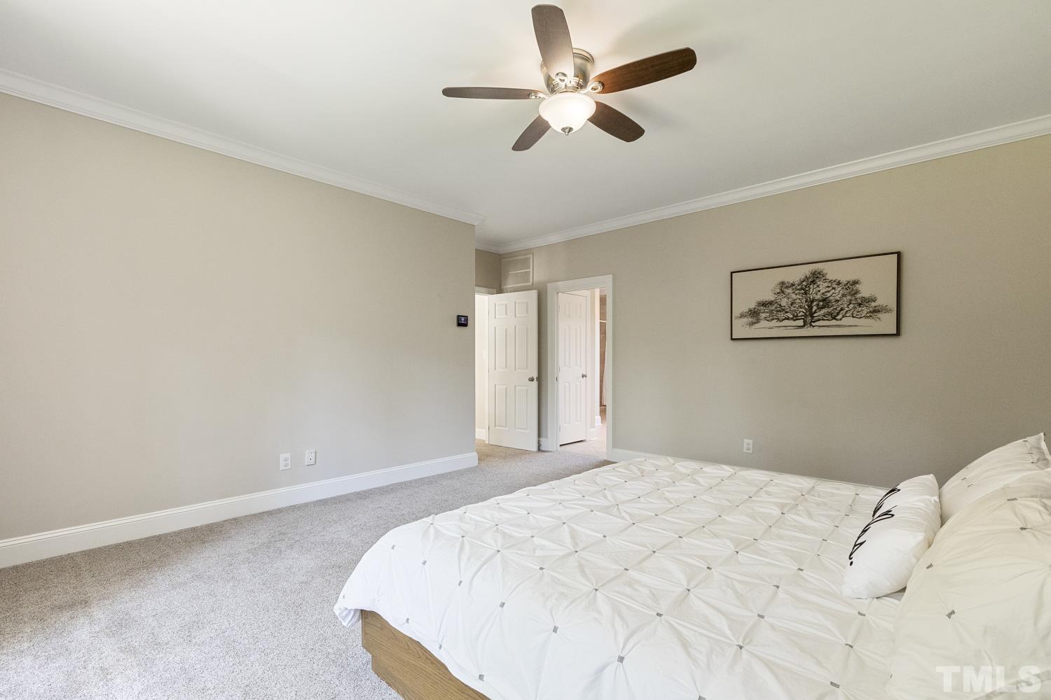 100 Greyfriars Lane Cary, NC 27518 - Photo 48 of 71 a bedroom with a large bed
