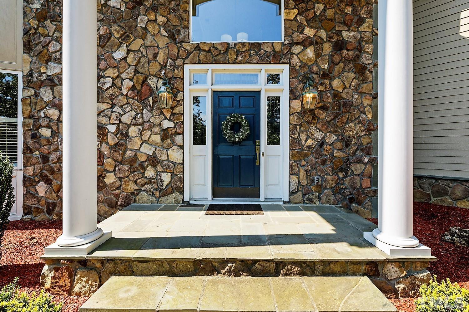100 Greyfriars Lane Cary, NC 27518 - Photo 5 of 71 a front view of a house with a yard