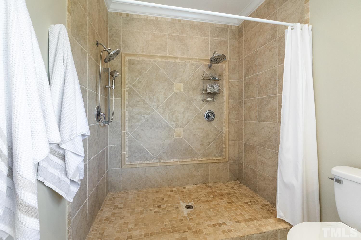 100 Greyfriars Lane Cary, NC 27518 - Photo 51 of 71 a bathroom with a shower and toilet