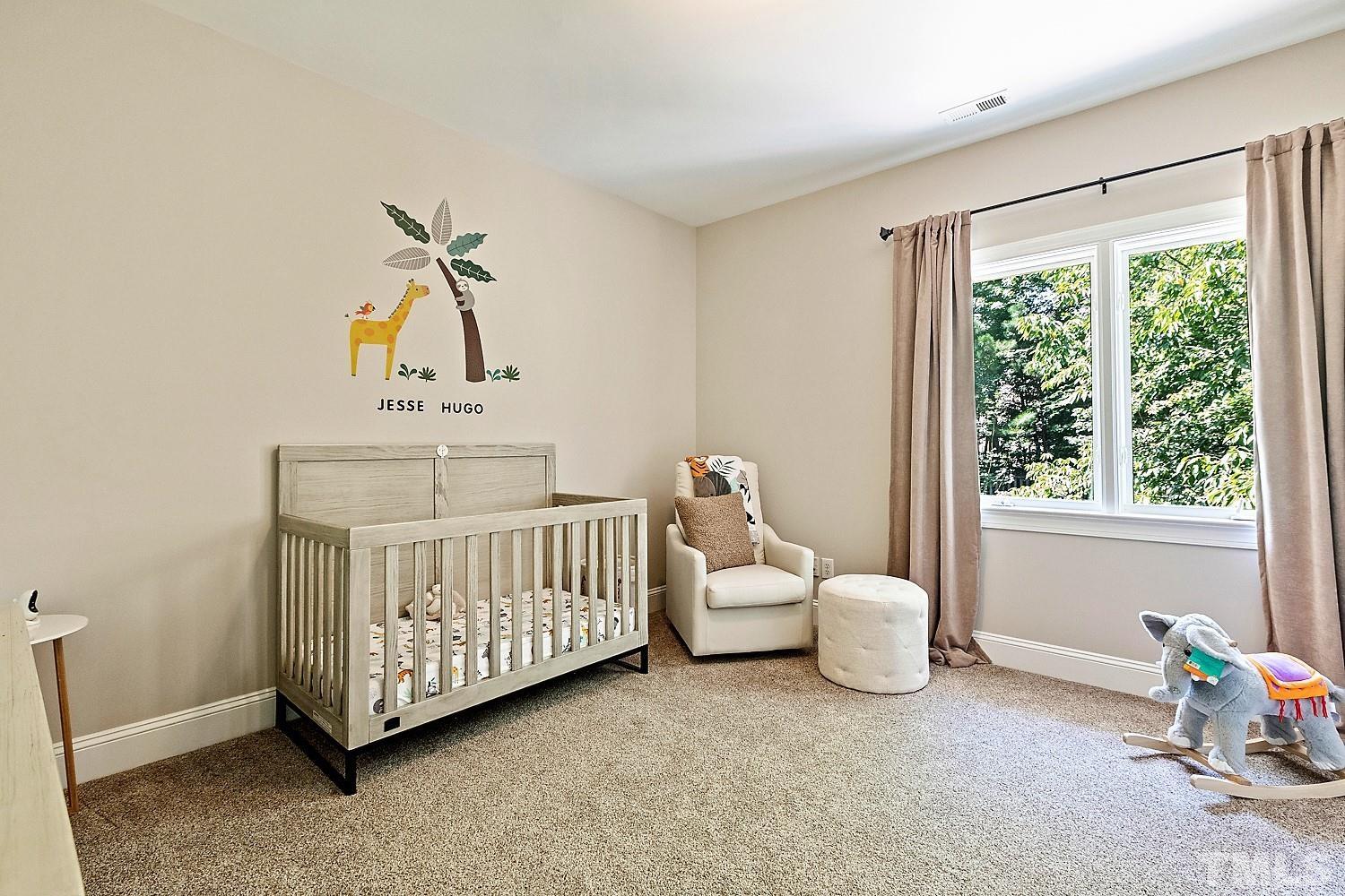 100 Greyfriars Lane Cary, NC 27518 - Photo 54 of 71 a bedroom with a bed and a window