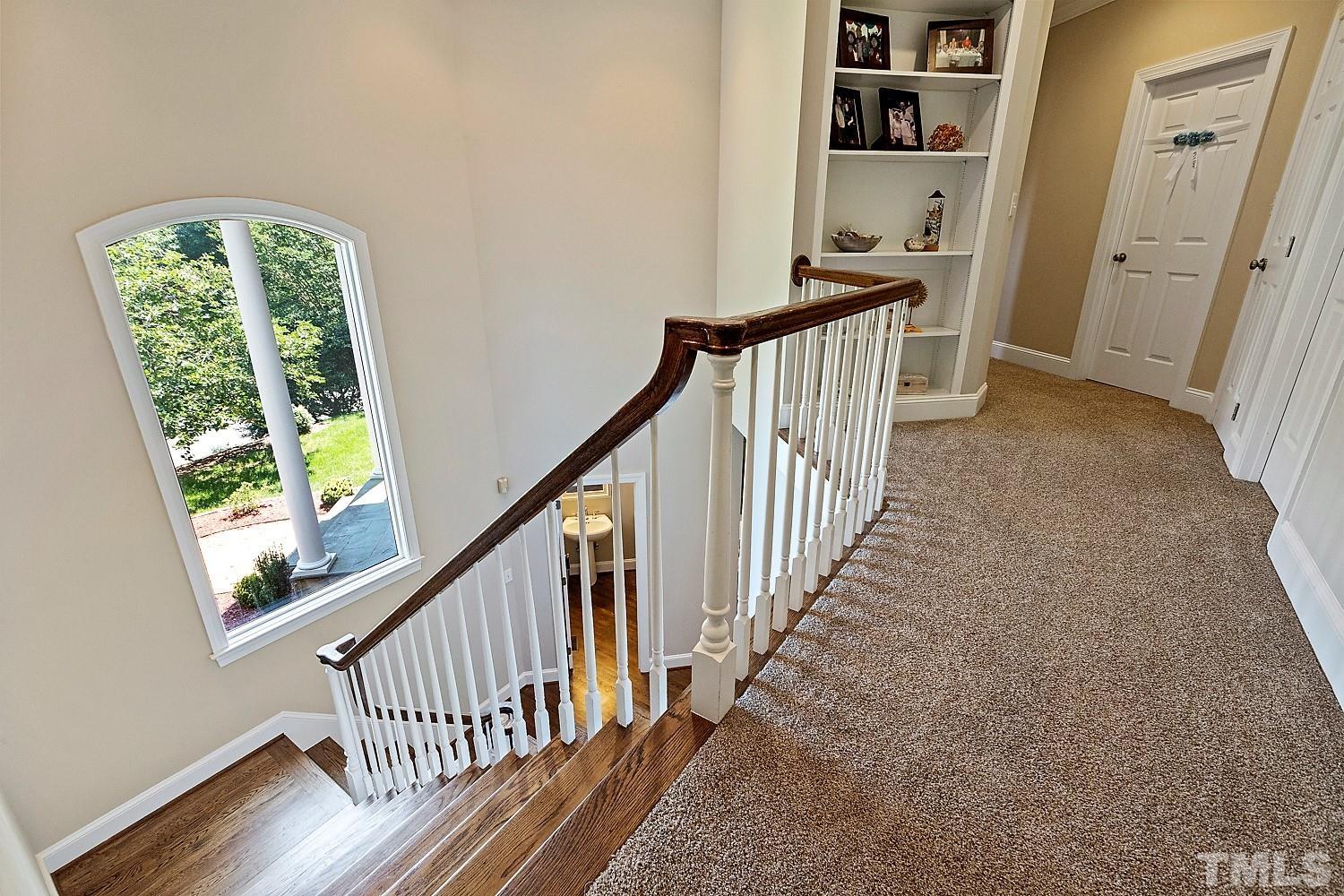 100 Greyfriars Lane Cary, NC 27518 - Photo 58 of 71 a view of entryway with wooden floor and stairs