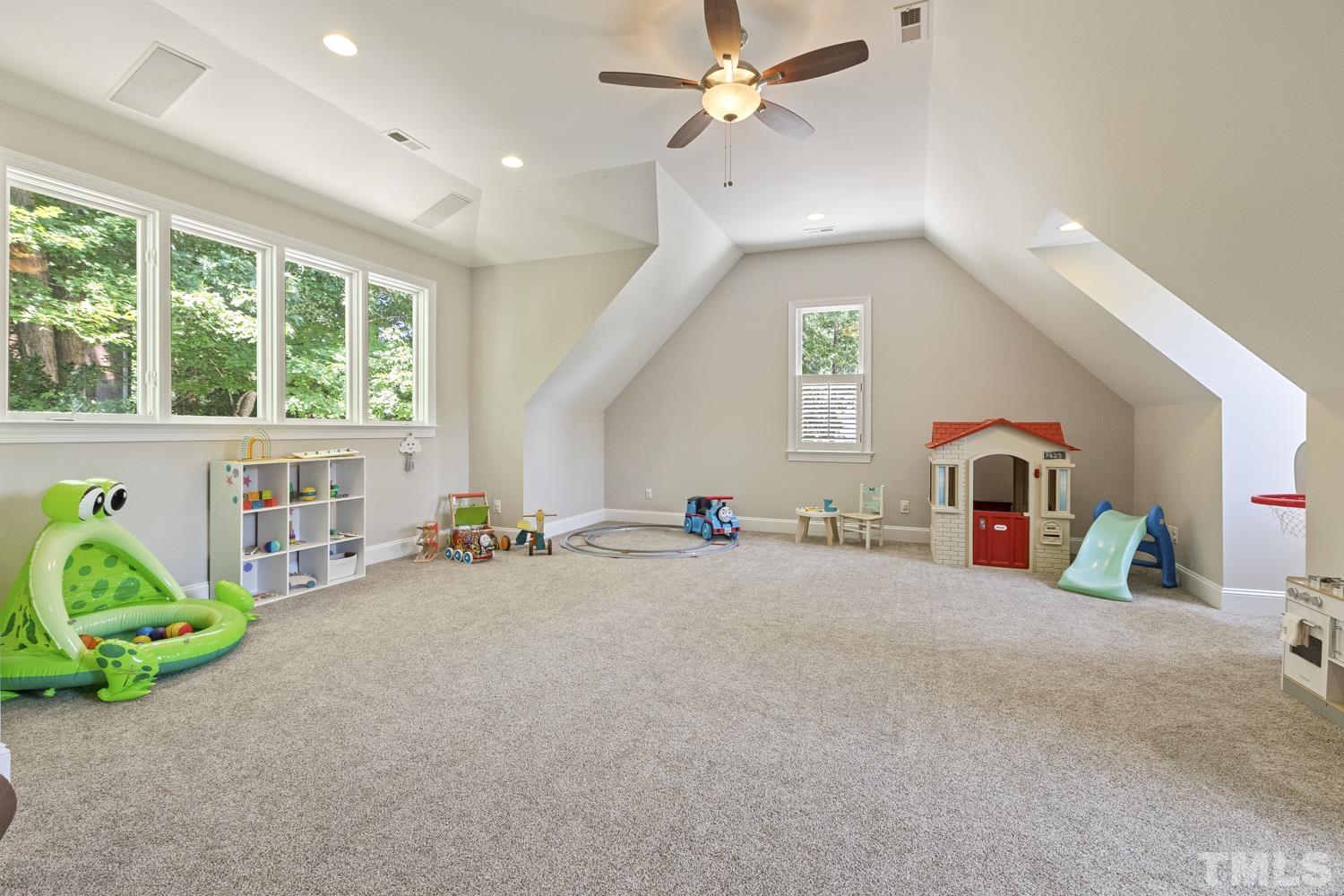 100 Greyfriars Lane Cary, NC 27518 - Photo 64 of 71 a view of a livingroom with furniture and a flat screen tv