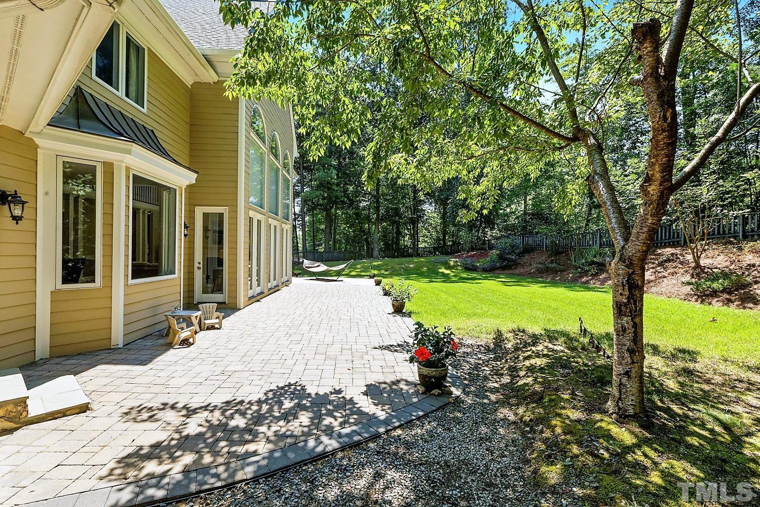 100 Greyfriars Lane Cary, NC 27518 - Photo 69 of 71 a view of a backyard with a garden and plants