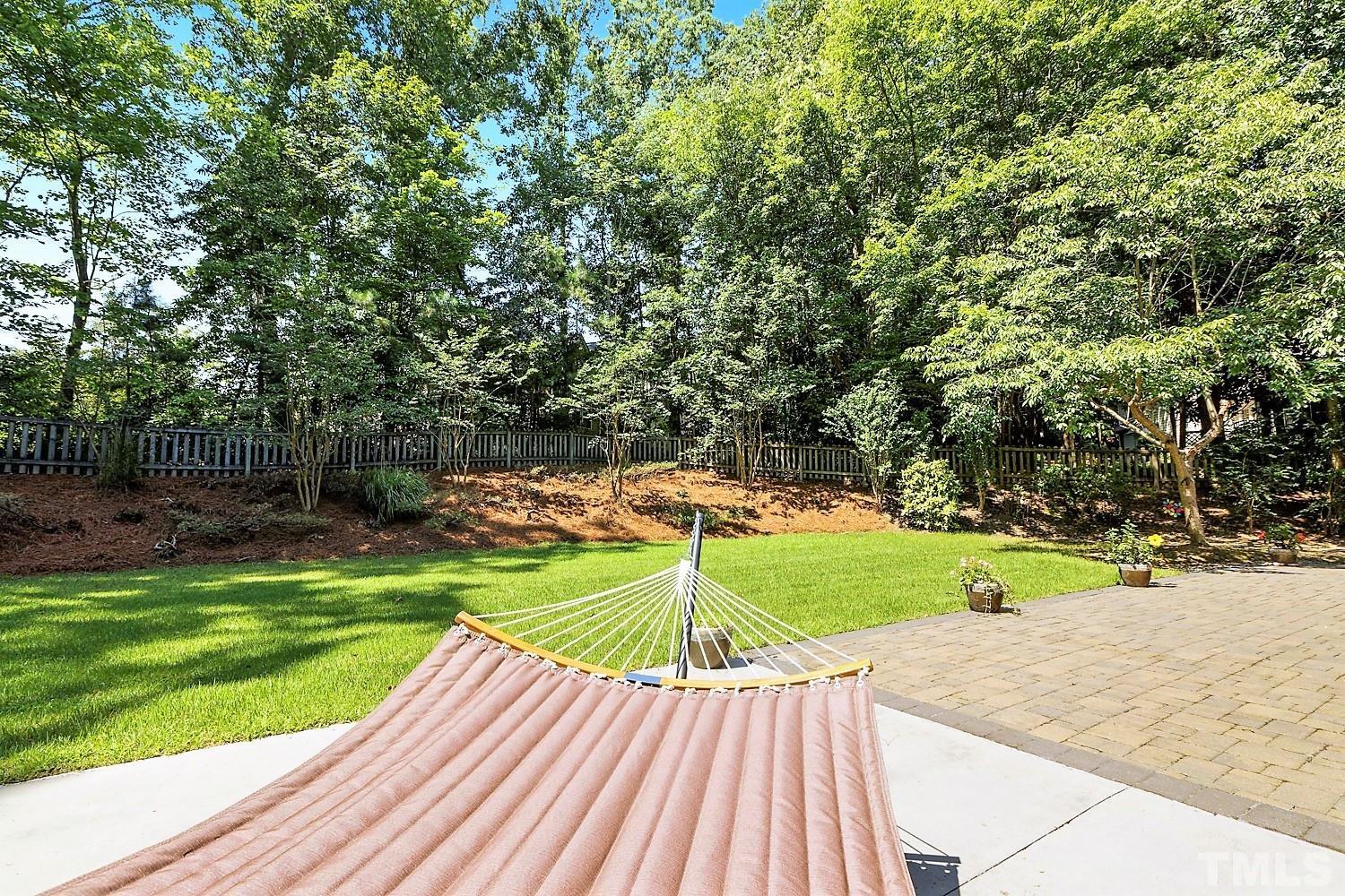 100 Greyfriars Lane Cary, NC 27518 - Photo 71 of 71 a view of a backyard with a garden