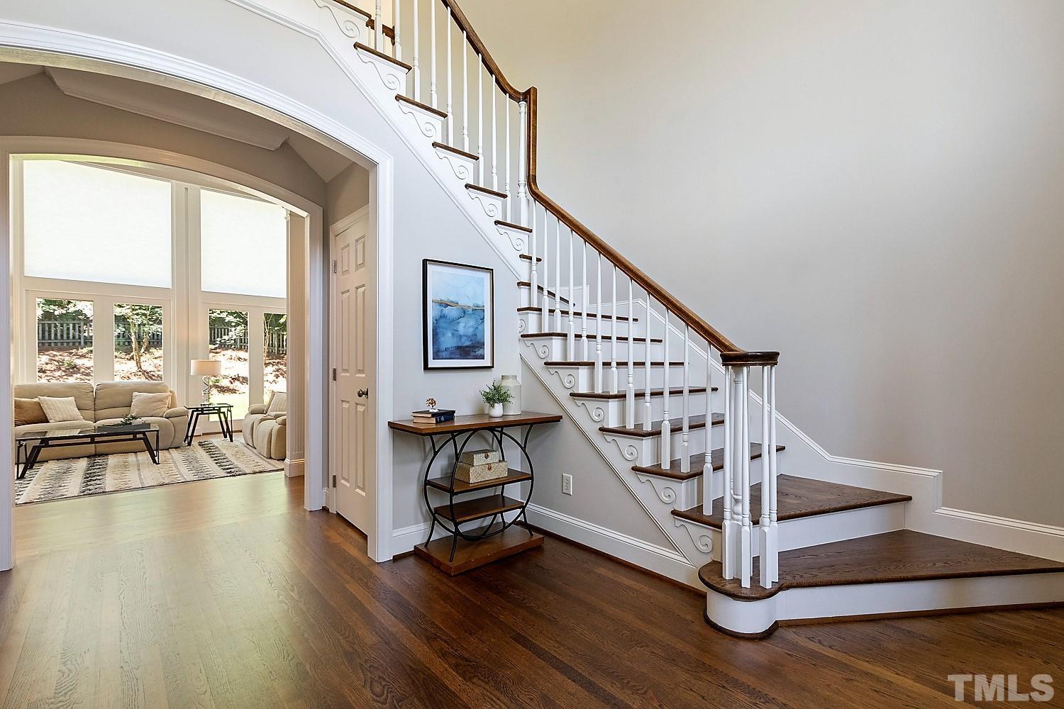 100 Greyfriars Lane Cary, NC 27518 - Photo 9 of 71 a view of entryway with wooden floor and stairs