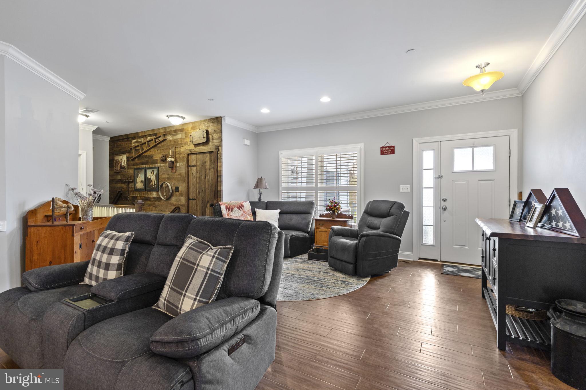308 Rockspring Church Road Forest Hill, MD 21050 - Photo 13 of 79 a living room with furniture wooden floor and a flat screen tv