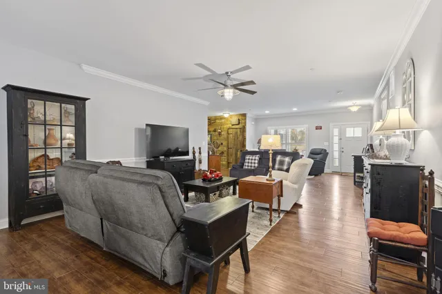 a kitchen with granite countertop a center island stainless steel appliances cabinets and a window