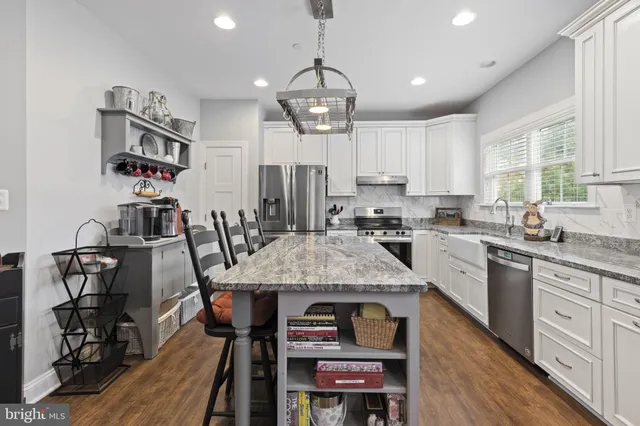 a bathroom with a sink vanity and a mirror
