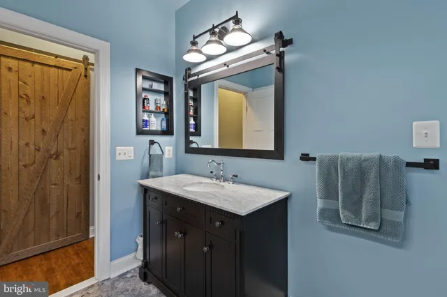 a kitchen with stainless steel appliances granite countertop a sink stove and microwave