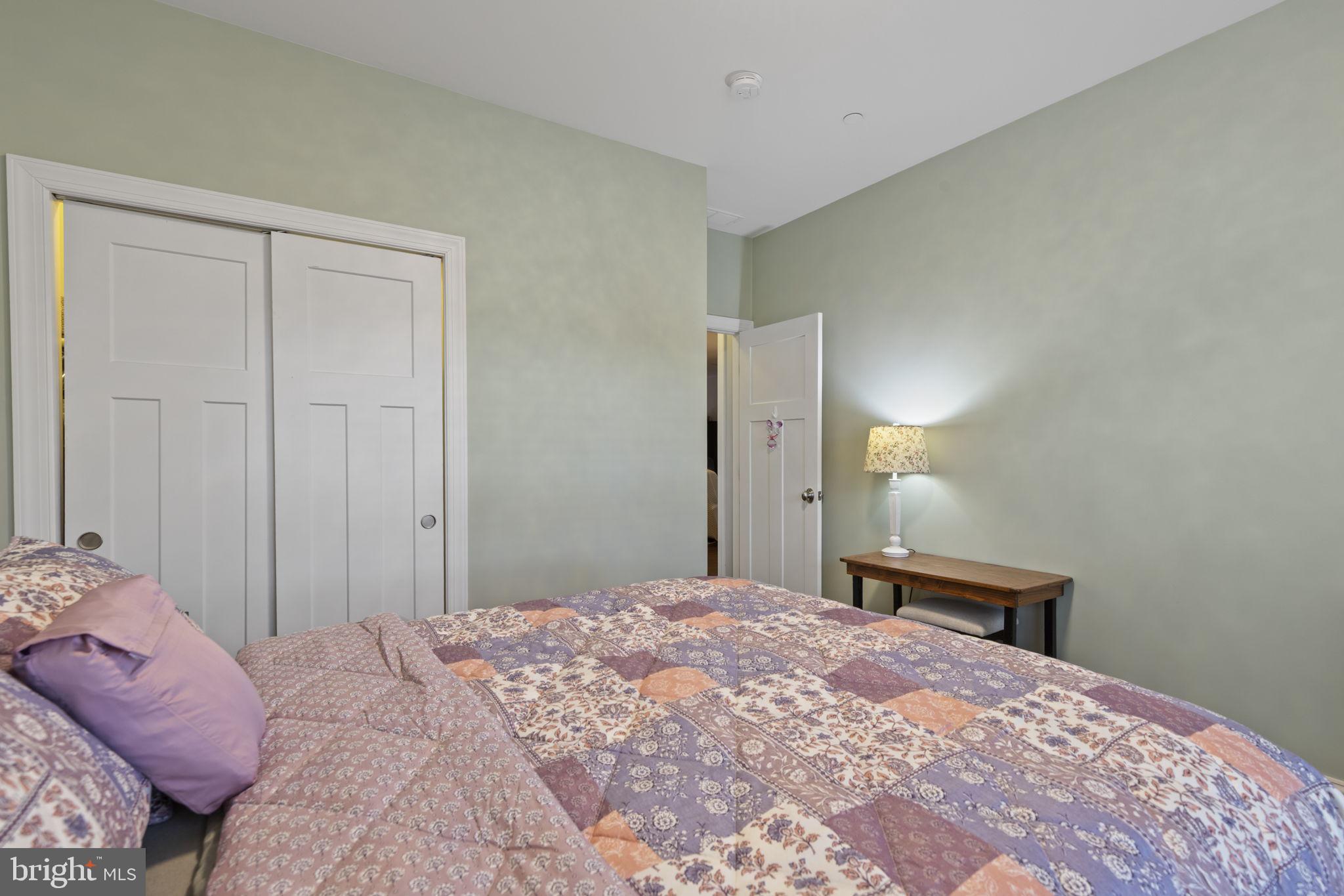 308 Rockspring Church Road Forest Hill, MD 21050 - Photo 36 of 79 a bedroom with a large bed and a chandelier