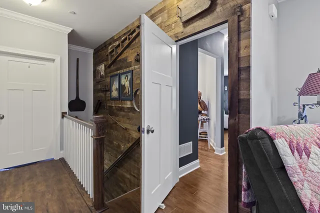 a reading room with furniture and a book shelf