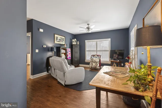 a view of a chairs and table on the wooden deck