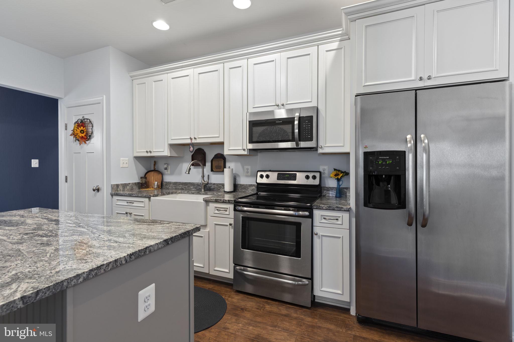 308 Rockspring Church Road Forest Hill, MD 21050 - Photo 45 of 79 a kitchen with stainless steel appliances granite countertop a refrigerator stove and microwave