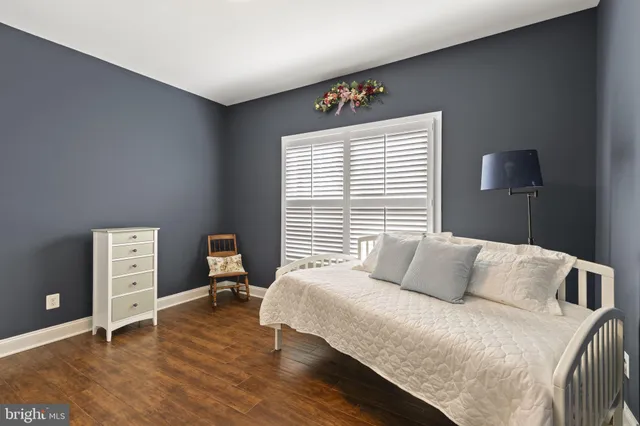 a view of a house with a yard and potted plants