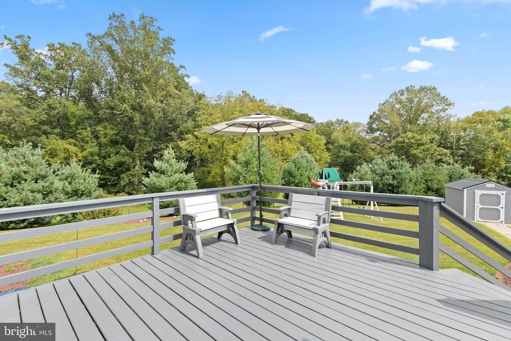 308 Rockspring Church Road Forest Hill, MD 21050 - Photo 59 of 79 a view of a chairs and table on the wooden deck