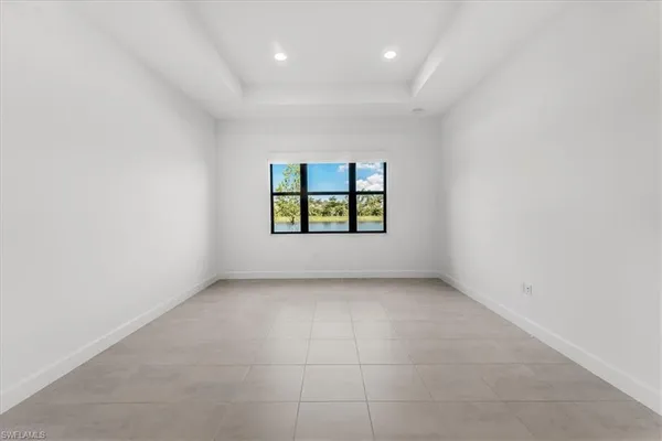 a large spacious bathroom with a tub shower a mirror and a double vanity sink