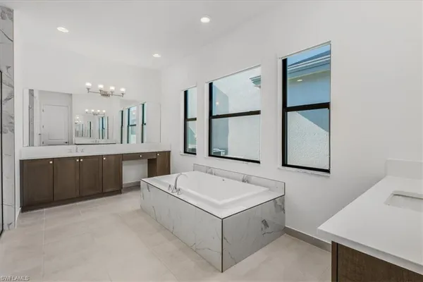 a bathroom with a shower and a sink