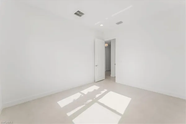 a bathroom with a granite countertop sink a toilet and bathtub