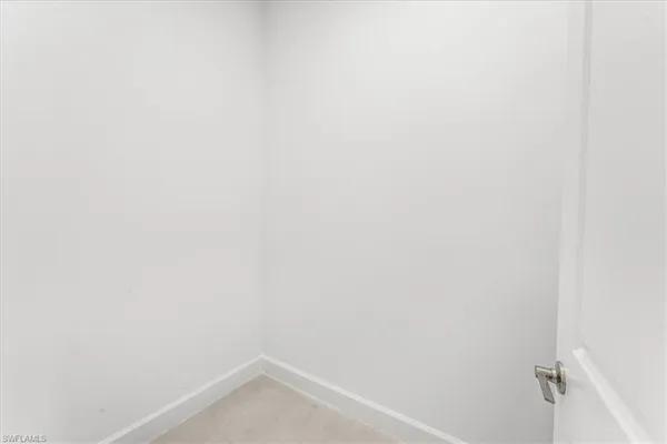 a view of empty room with windows