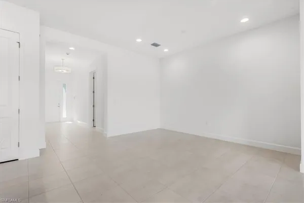 a view of kitchen with table and chairs