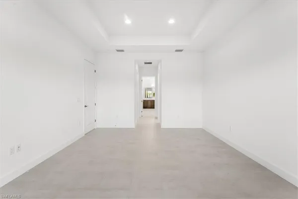 a kitchen with cabinets and stainless steel appliances