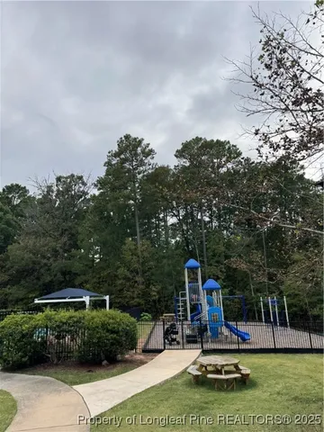 a childrens park with lots of swings and slides