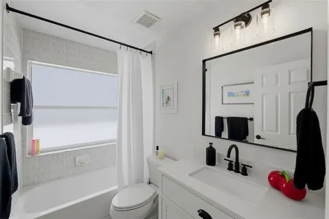 a kitchen with stainless steel appliances granite countertop a sink and a window