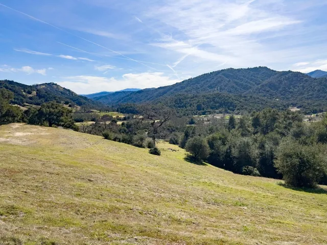 a view of ocean and mountain