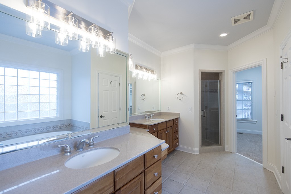 149 Allenhurst Circle Franklin, TN 37067 - Photo 14 of 44 a bathroom with a granite countertop sink a shower and a mirror