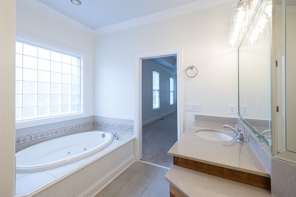 149 Allenhurst Circle Franklin, TN 37067 - Photo 15 of 44 a bathroom with a tub sink and mirror