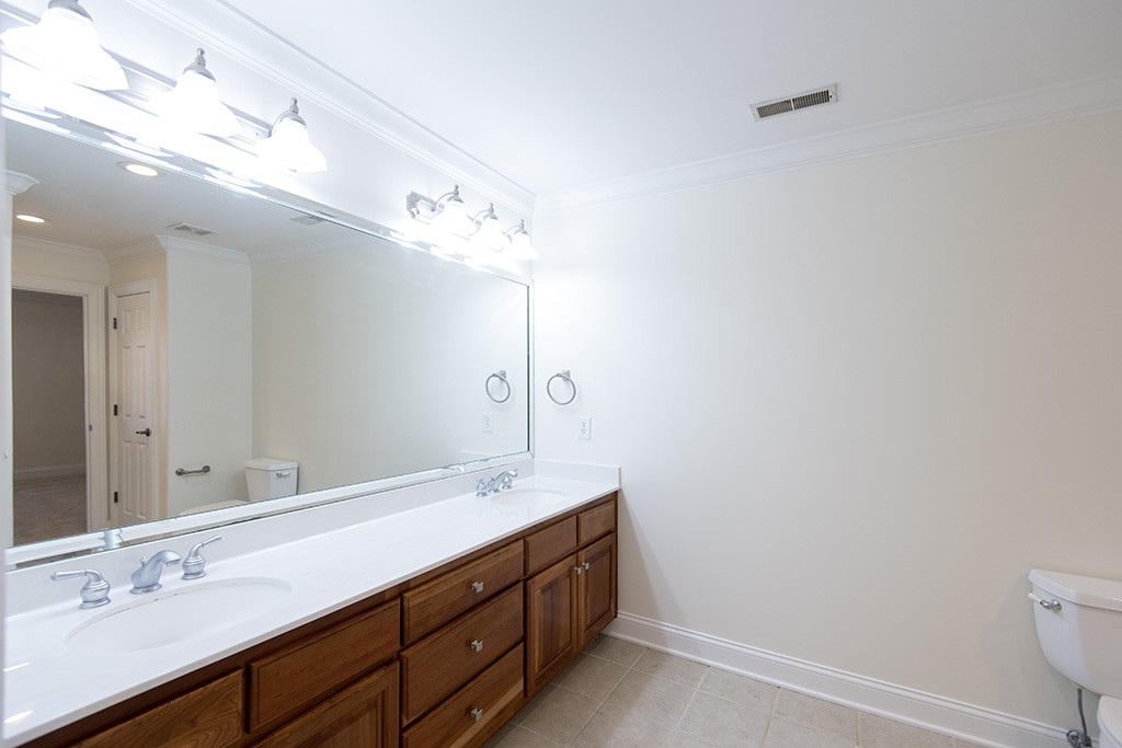 149 Allenhurst Circle Franklin, TN 37067 - Photo 30 of 44 a bathroom with a double vanity sink and a mirror