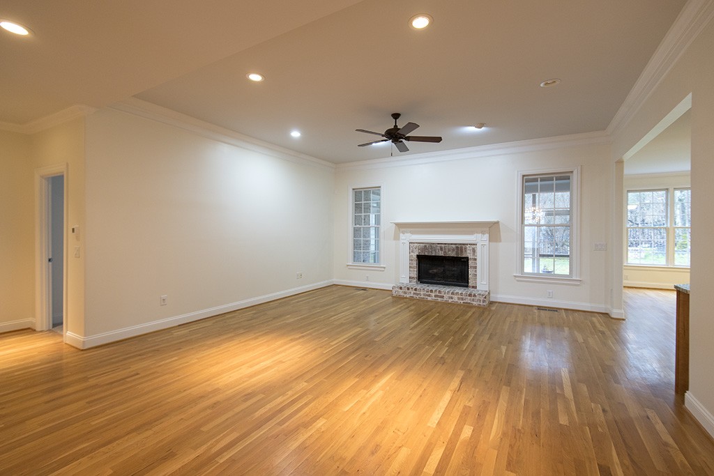 149 Allenhurst Circle Franklin, TN 37067 - Photo 5 of 44 a view of empty room with wooden floor and fireplace