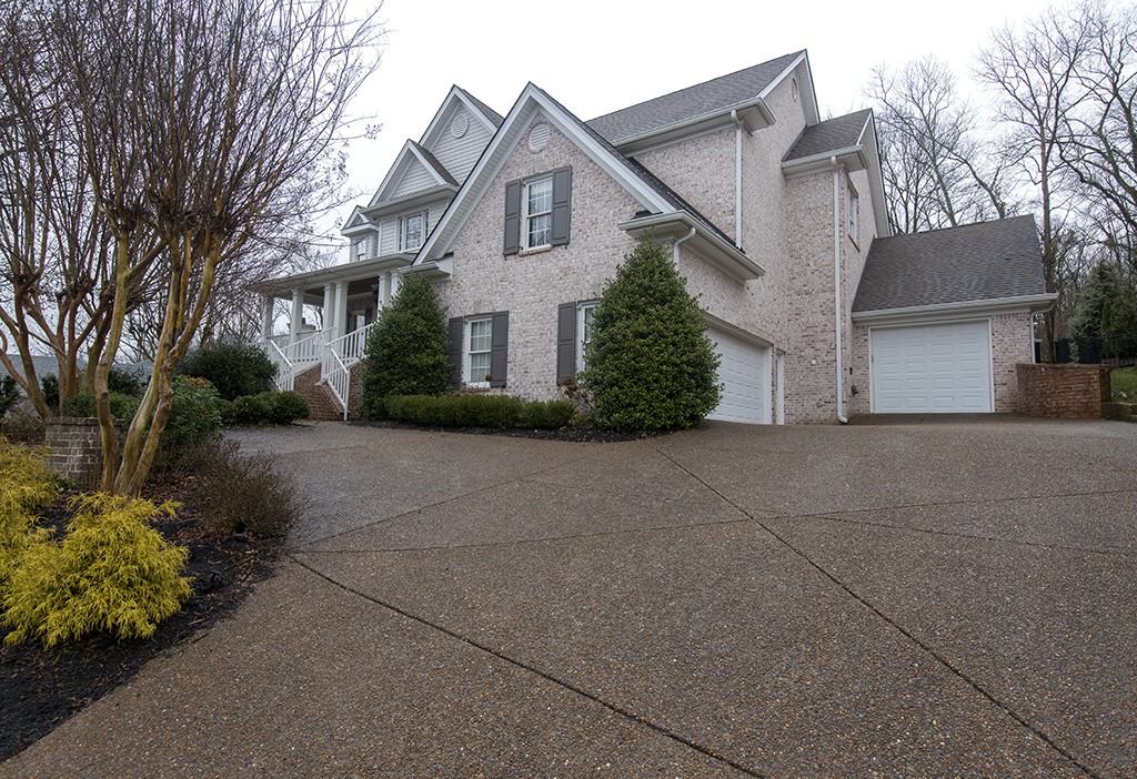 149 Allenhurst Circle Franklin, TN 37067 - Photo 41 of 44 a front view of a house with a yard and garage