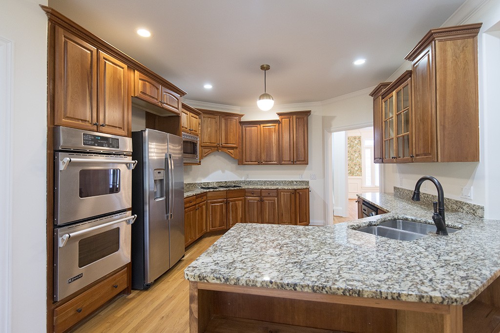 149 Allenhurst Circle Franklin, TN 37067 - Photo 6 of 44 a kitchen with stainless steel appliances granite countertop a sink refrigerator and cabinets