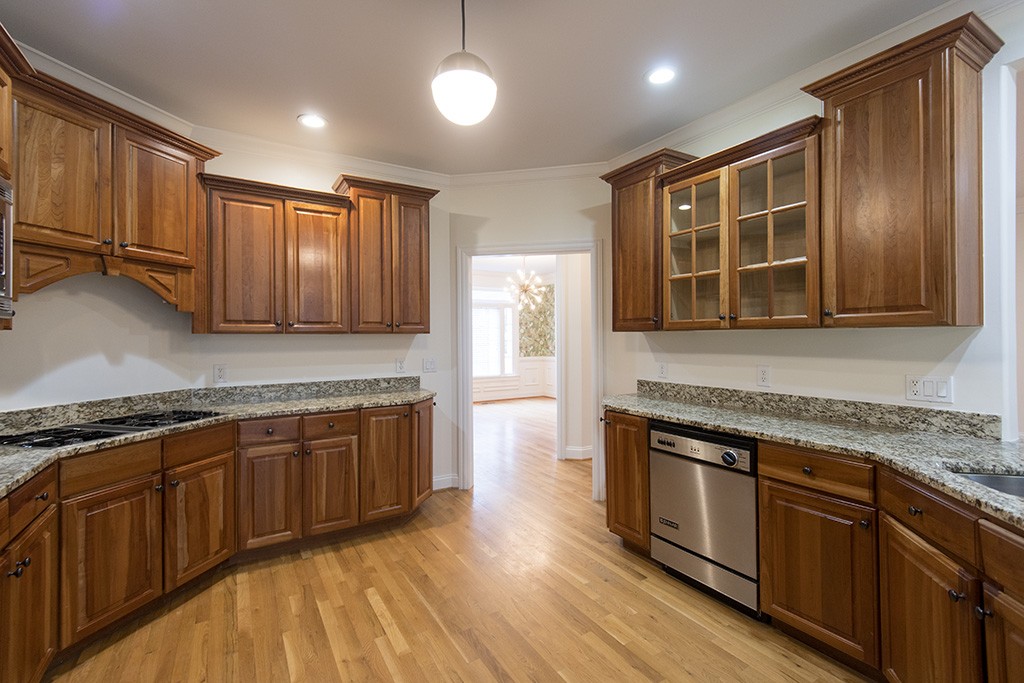 149 Allenhurst Circle Franklin, TN 37067 - Photo 7 of 44 a kitchen with stainless steel appliances granite countertop wooden cabinets and a stove top oven