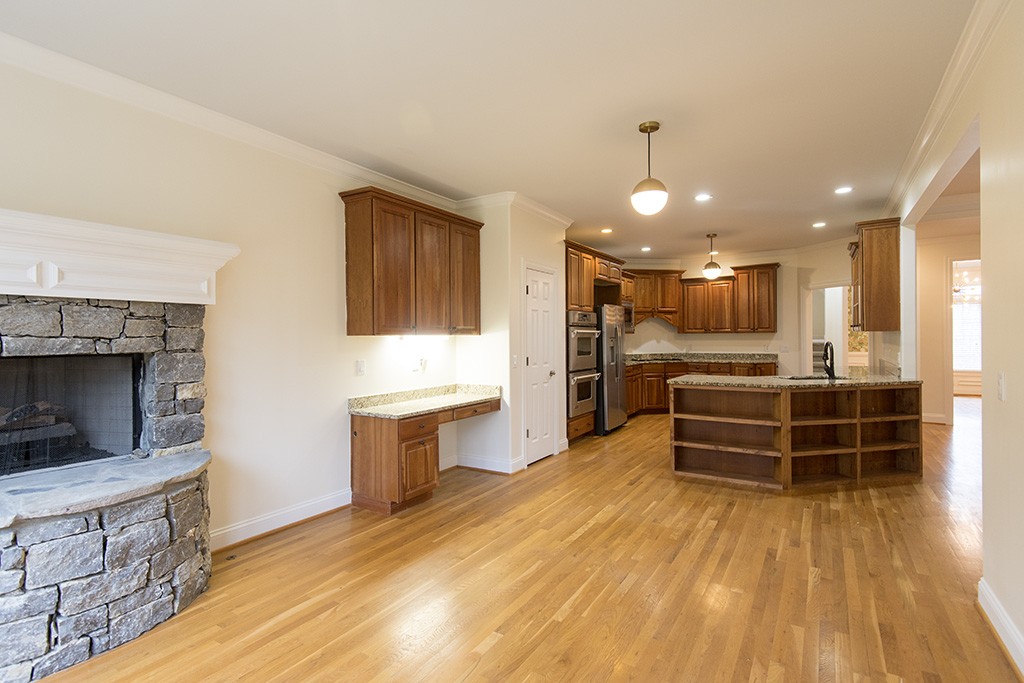 149 Allenhurst Circle Franklin, TN 37067 - Photo 8 of 44 a kitchen with stainless steel appliances kitchen island granite countertop a stove a sink and a refrigerator