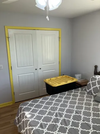 a bedroom with a bed and a table
