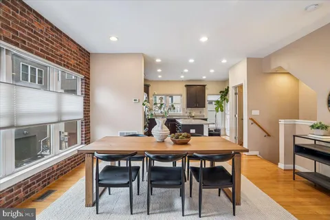 a kitchen with stainless steel appliances granite countertop a refrigerator a stove top oven a sink and dishwasher