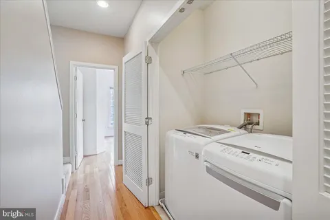 a bathroom with a granite countertop double vanity sink and a mirror