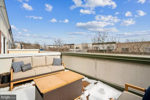 a view of a street with a building in the background