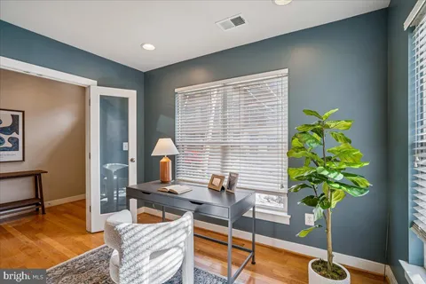 a bath room with a sink a toilet and a bath tub